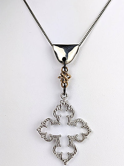 We love the refined silhouette of this open cross cast in sterling silver. The Avita cross is perched below an antique Victorian gold fill link and a sterling silver dome-shaped foldover bail.   Avita works in tandem with your desire to feel transported.