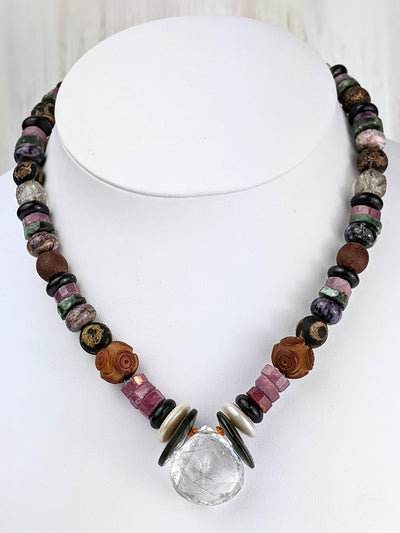 Orbis embraces the light with a tourmalated quartz center stone, flanked by vintage jade and ruby rondelle beads. She layers beautifully with other Romys or your own favorite necklaces. 
