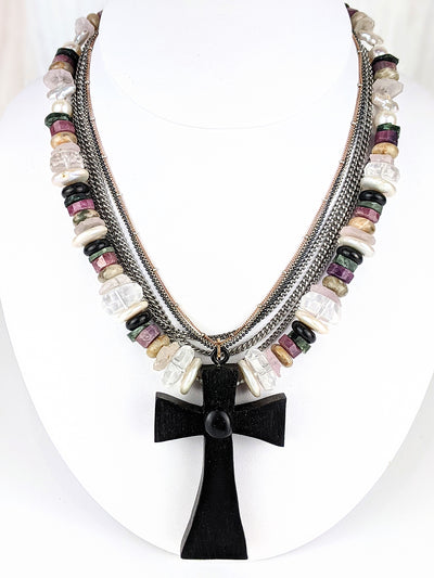 <p>Cross purposes. A one-of-a-kind Victorian hand-carved bog oak cross, circa 1900, is the centerpiece of this multi-composite necklace. The dimensions of the cross are 68mm x 46mm x 9mm deep. Bold and weightless. Viola mixes&nbsp;strands of chain, one in rose gold fill, the other in sterling silver, and&nbsp;three strands of stainless steel curb chain with some delicate color therapy.
